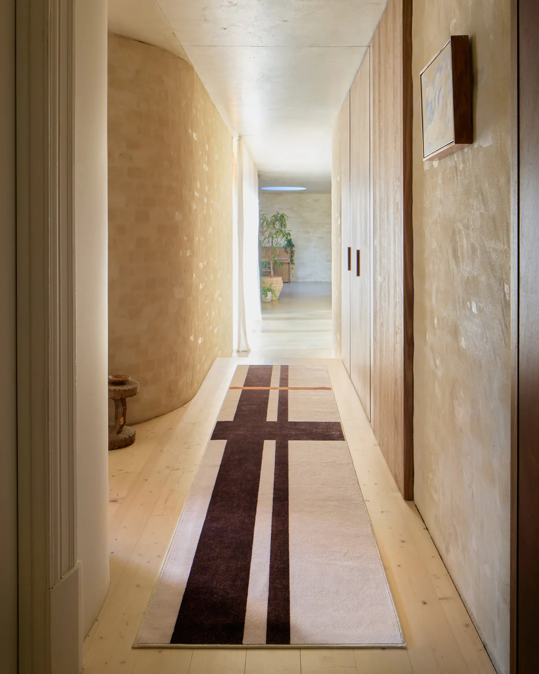 Scala Ivory Brown runner — The Local Project x Ruggable, in an architectural hallway setting